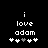 Black background with white pixelated text 'i love adam' and five heart symbols below, where the third heart changes from white to gray between frames.