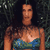 Pixelated static image of a person in a strapless swimsuit against dark foliage background with visible dithering and low-resolution rendering artifacts.