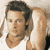 Static pixelated image of a person's face and upper body in profile view with visible hair, skin tones, and partial clothing details.