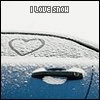 A blue car door with a heart drawn in the snow above the handle, text "I LOVE SNOW" at the top, and water droplets on the surface.