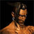 Pixelated image of a shirtless figure with dark hair and a light brown skin tone against a black background.