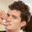 A 48x48 pixel animated buddy icon featuring a side-profile of a person with dark hair on the left and green text reading "Original Icons .com" on a dark green background on the right, displayed as two sampled frames in a contact sheet layout.