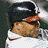 A 4-frame contact sheet of a baseball player in various poses and expressions, including batting stance, smiling face, laughing expression, and repeated text on black background.