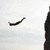 Pixelated black curved line on light gray background with text block reading 'Bella's all about extreme sports these days' in pixel font.