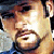 A 2x2 contact sheet of a pixelated animated icon featuring a man's face and repeated text with heart symbols across frames.