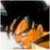 A static pixelated image shows a bright orange and yellow flame-like shape against a dark background with light gray and white areas.