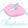 Pixel art of a pink cushion with blue trim holding a silver glass slipper, surrounded by light blue stars and the name "Stephanie" in cursive script.