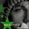 A grayscale portrait of a person with curly hair overlaid with green star shapes and text reading "JESSE McCARTNEY".