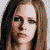 A static image shows a person with long brown hair and a neutral expression, overlaid with red X marks, with text below reading "AVRIL SUCKS" and "nerd-love.org/avril sucks".