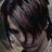 A pixelated image of a person with dark hair and a light-colored top, with red text reading 'Criss Angel' and 'Rocks' on black and gray backgrounds.