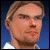 A pixelated animated sequence shows a man's face with blonde hair and light stubble, transitioning through various expressions against a blue background.