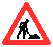 A red triangular warning sign with a white interior containing a black silhouette of a person shoveling dirt, set against a gray background.