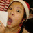 A four- shows a person in Santa hat with red-and-white striped background, displaying text overlays and changing expressions