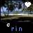 Animated sequence showing a landscape with trees and sky, featuring changing text elements over black bars beneath the scene.