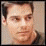 Two side-by-side pixelated images of a person with short dark hair, light skin tone, and neutral expression against a muted background.
