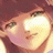 A 48x48 pixel animated contact sheet showing two frames of an anime-style character with reddish-brown hair and green eyes, alongside a black background with white text reading "Anime IM" and "COM" in stylized fonts.