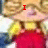 A pixelated cartoon character with blonde hair wears a yellow shirt and red overalls, displaying text above the head that changes across frames.