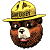 A pixelated cartoon bear mascot wearing a yellow ranger hat with visible text on the band, positioned next to green pixelated text reading "Original Icons .com" on a dark background.