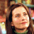 A 48x48 pixel buddy icon split into two frames showing a woman's face on the left and green text on a dark background on the right, with visible pixelation and dithering effects.