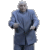 A man in a blue suit performs sequential hand gestures against a light gray background.