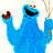 Pixelated blue cartoon character with wide black mouth, one hand holding red object, other hand holding thin sticks against white background.