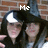 Two people in black hooded garments with white crescent symbols pose against a brick wall, with text overlays reading Me, and, Lexi.