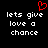Black background with white pixelated text reading 'lets give love a chance' and a red pixelated heart symbol above the text.