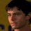 Four pixelated head-and-shoulders views of a person with dark hair against a yellow background with blue shapes.