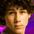 A four- shows a person with brown curly hair in two color and two grayscale , with blue text reading "the cute sensitive one" on the right
