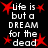 Black background with white text reading 'life is but a DREAM for the dead' surrounded by red starburst shapes.