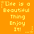 Yellow pixelated text on orange background reads 'Life is a Beautiful Thing Enjoy It!' with star and dot accents, repeated in a pattern