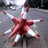 A pixelated image shows a red and white starburst shape on the left, with orange text reading "save..." above it and "the... CONES!!!" below.