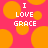 Pixelated text "I LOVE GRACE" on a pink background with orange circles, no visible animation changes.