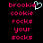 Pixelated text in bright pink and cyan on black background with a heart symbol replacing the 'i' in brookie.