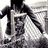 A black-and-white animated icon shows a figure in a long coat holding a large object, with motion suggesting the figure is walking forward.