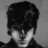 A 48x48 pixel buddy icon split into two frames: left frame shows a grayscale portrait of a person with dark hair, right frame displays green text on a solid green background reading "Original Icons .com".