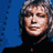 A 3x3 contact sheet of pixelated animated frames featuring five distinct male faces against blue and white backgrounds with visible text "DEF LEPPARD" and "ROCK OF AGES" in blocky white font on a dark blue background.