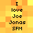 Pixelated text on a yellow-orange gradient background with two identical vertical of black pixelated words