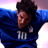Pixelated static image of a person in blue sports attire with number 10, arms raised against gradient background.