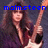A pixelated image of a person with long dark hair holding a guitar, with blue text above the head.