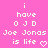Pixelated text on a pink background with white lettering and heart symbol, arranged in vertical lines.