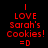 Red pixelated text on black background with white rectangular overlays shifting across the image, displaying 'LOVE Sarah's Cookies! =D' in a