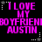 Pixelated text in bright pink on black background with white star and dot patterns, repeating 'I LOVE MY BOYFRIEND AUSTIN' across two
