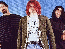 Three figures stand against a blue pixelated background; the right side displays large yellow text on dark brown.