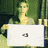 Pixelated image of a figure with light hair holding a white rectangular object against a green background.