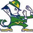Pixelated character in green outfit with yellow accents, wearing a hat and holding a microphone-like object while striking a pose.