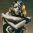 Pixelated character with blonde hair and armor, two views showing text change from blank to 'Fergie!' in yellow.