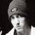 Black-and-white pixelated image of a person wearing a beanie hat with visible facial features and partial clothing, displayed on a transparent background.