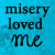 Blue background with black text reading 'misery loved me' and a small solid black heart symbol on the right side.