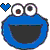 Pixelated blue cartoon character with large white eyes, dark pupils, and a wide black mouth, accompanied by a small blue heart symbol to the left.